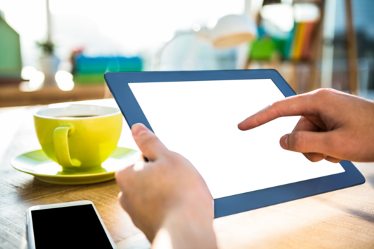 Cropped image of hipster businessman using tablet