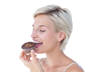 Attractive woman eating muffin 