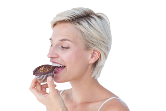 Attractive woman eating muffin - Powered by Adobe