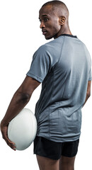 Rear view of confident athlete standing with rugby ball