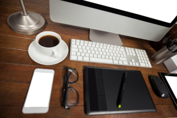 High angle view of mobile phone with black coffee and belongings on desk