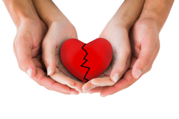 Couple holding broken heart in hands