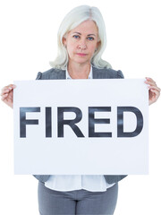 Portrait of upset businesswoman holding fired sign
