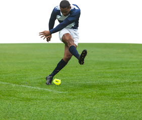 Male rugby player kicking the ball