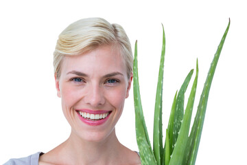 Naklejka premium Attractive woman holding aloe vera plant