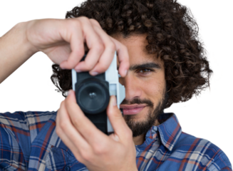 Portrait of male photographer taking picture 
