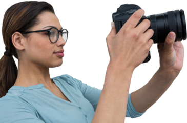 Young woman photographing with digital camera