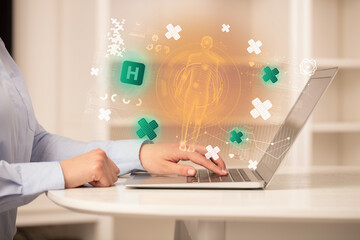 Doctor working on laptop with healthcare concept
