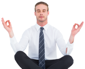 Businessman meditating in lotus pose