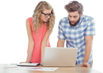 Man using laptop while discussing with woman at desk 