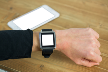 Businesswoman with smart watch on wrist