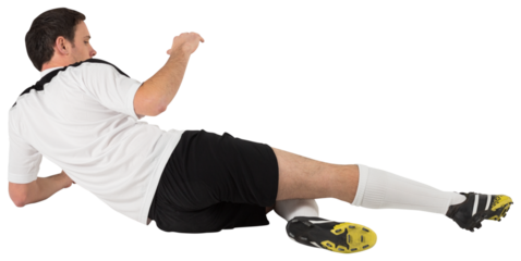 Football player in white kicking