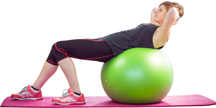 Side view of sporty woman exercising on fitness ball
