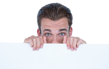 Portrait of man hiding behind billboard