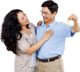 Smiling couple holding a set of keys