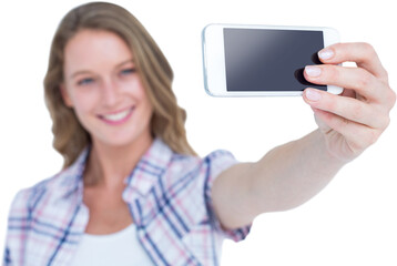 Pretty hipster taking selfie with smartphone 