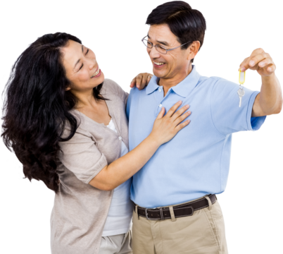 Smiling couple holding a set of keys