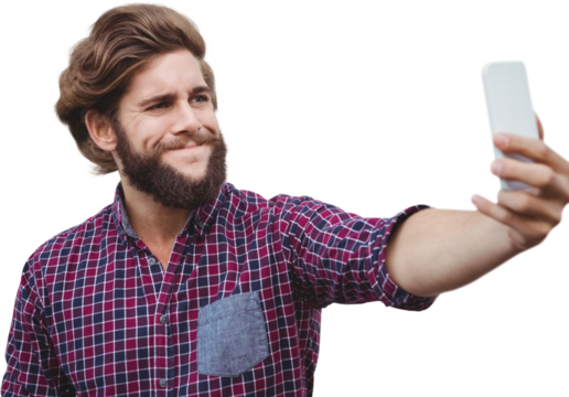 Hipster taking selfie against wooden wall