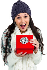 Surprised woman opening red gift box