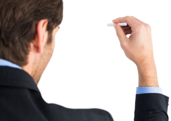 Businessman writing with a white chalk