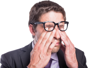 Worried businessman rubbing eyes