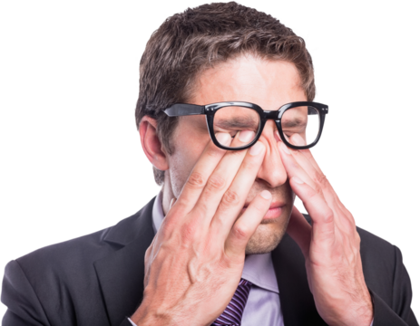 Worried businessman rubbing eyes