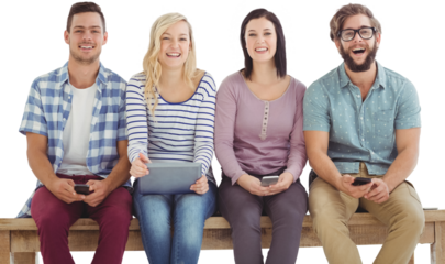 Portrait of smiling business people holding electronic gadgets 