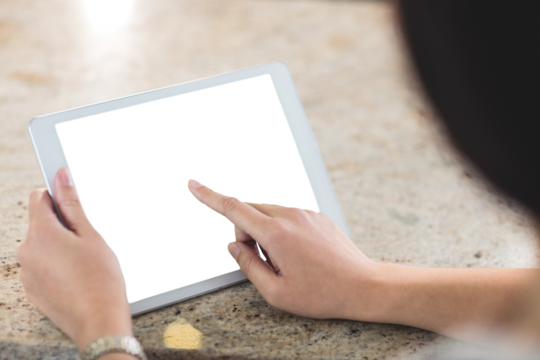 Cropped image of woman using tablet computer