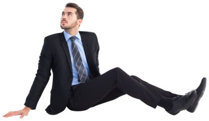 Businessman sitting on floor looking up