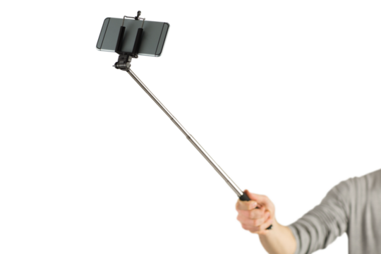 Casual man using a selfie stick - Powered by Adobe