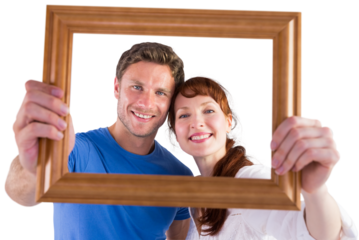 Couple holding frame ahead of them