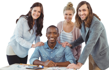 Portrait of smiling business team putting hands on man shoulder at desk 