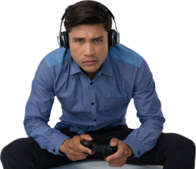 Portrait of young businessman wearing headphones while playing video game