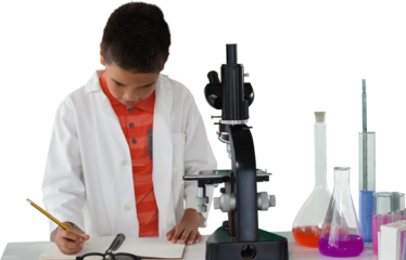 Schoolboy writing on note pad