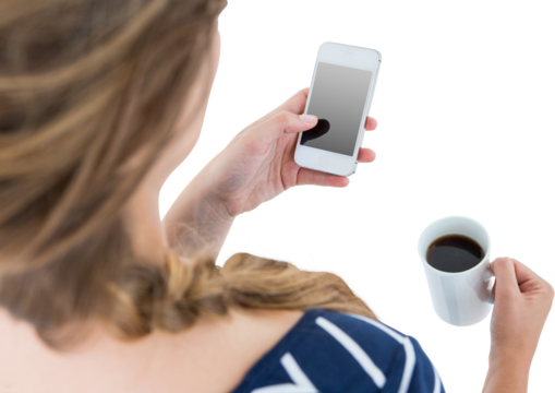 Woman using smartphone and holding mug 