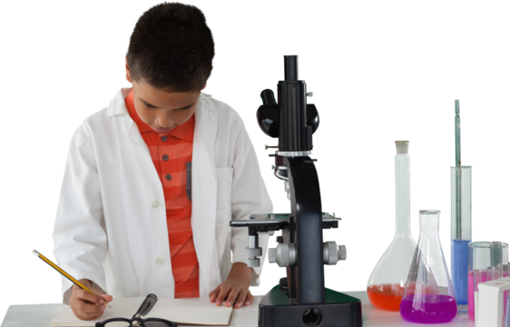 Schoolboy writing on note pad