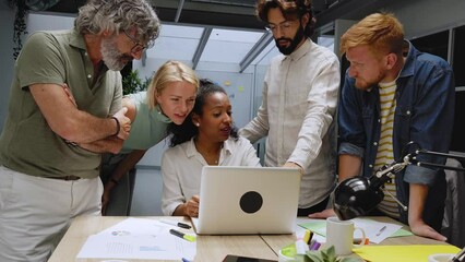 Diverse team of business professionals gathered in office conference room. Creative group around table female leader. Colleagues talk marketing campaign, social media strategy. People modern workplace - Powered by Adobe
