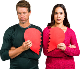 Portrait of serious couple holding cracked heart shape 