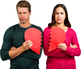 Portrait of serious couple holding cracked heart shape 