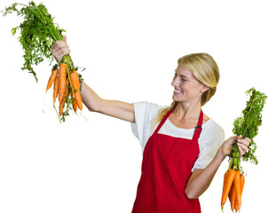 Smiling young woman holding carrot - Powered by Adobe