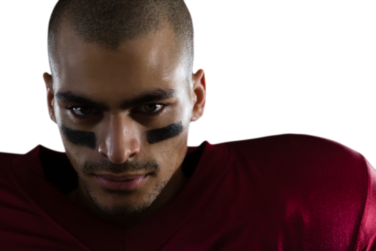 Confident American football player with face paint