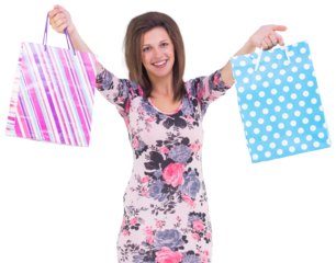 Young woman in floral dress holding up shopping bags