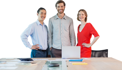 Portrait of coworkers standing at table