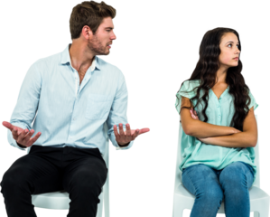 Couple sitting on chairs having argument