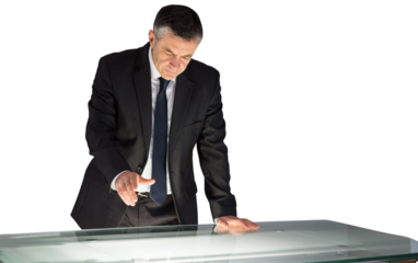 Mature businessman using interactive desk