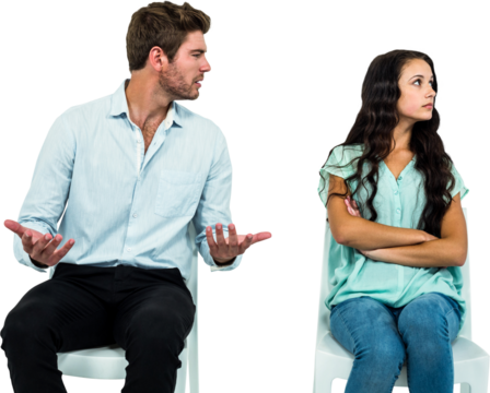 Couple sitting on chairs having argument