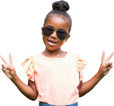 Girl wearing sunglasses while showing victory sign 