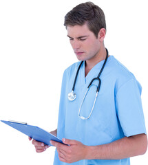 Serious male doctor holding clipboard