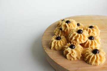 Kue Semprit or Semprit Cookies with chocolate chips on top. These cookies commonly served for Idul Fitri or Lebaran The Great Islamic Day. Kue Lebaran.