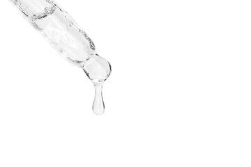 Cosmetic pipette with dripping liquid and drops on the south, white isolated background, serum, serum, gel, vitamin, water, oil.